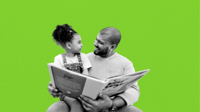 Black father and daughter reading