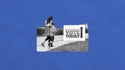 Mother and son walking along a rural road with Vote Today sign by the side.