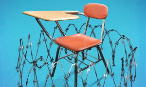 Barbed wire fence surrounding a school desk.