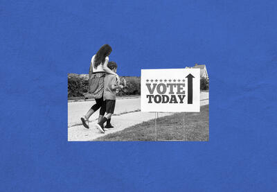 Mother and son walking along a rural road with Vote Today sign by the side.