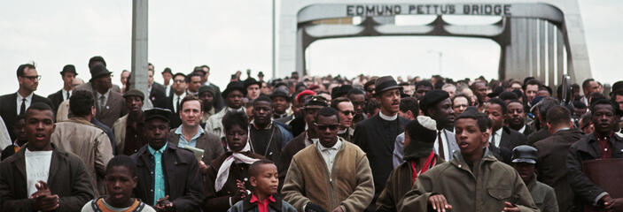 Civil Rights Movement activists marching over the Edmund Pettus Bridge.