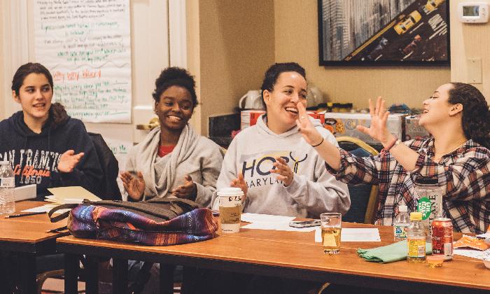 Students laugh during a discussion at Operation Understanding