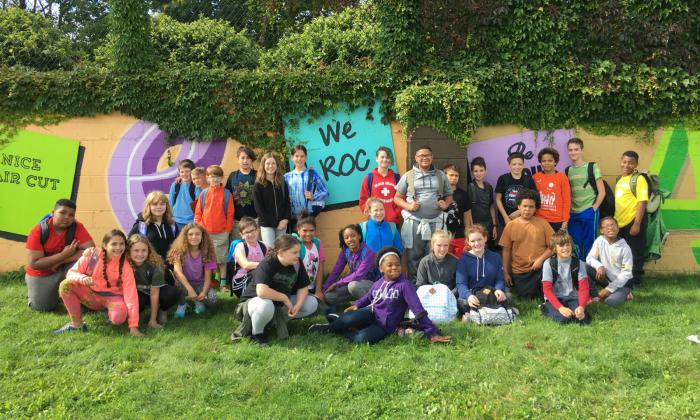 Students in front of We ROC mural | TT Grants Spotlight